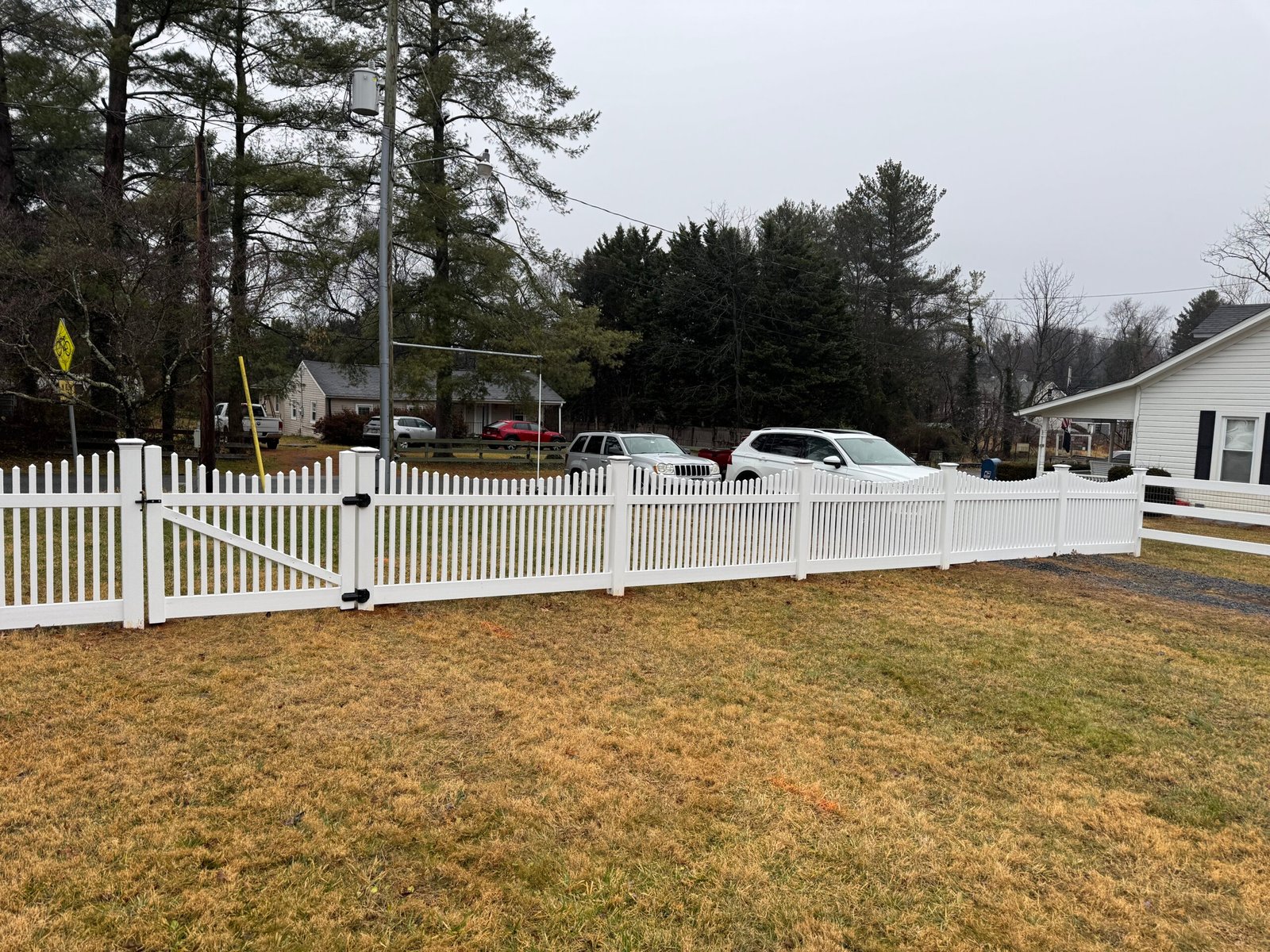 White picket fence installation by Shenandoah Fence