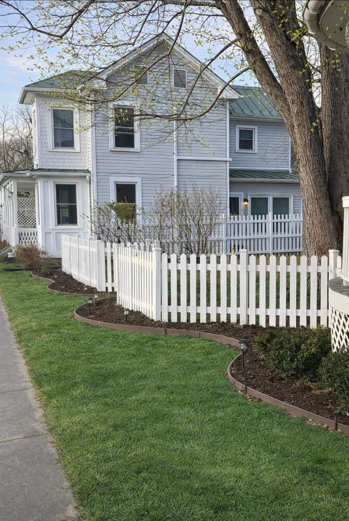 White picket fence in front yard
